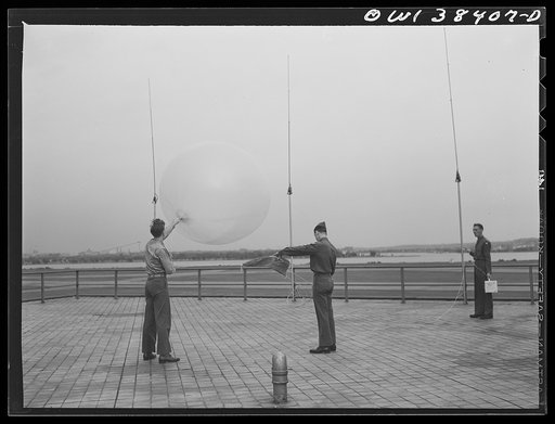 Washington, D.C. The U.S. Weather Bureau station at the National Airport. Atmospheric conditions are transmitted by a weather radio instrument attached to the balloon which ascends to heights of fifteen to twenty miles