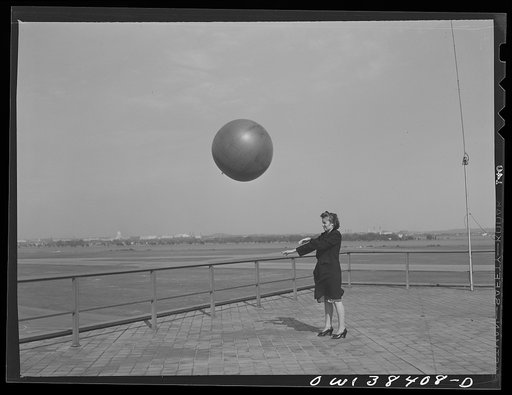 Washington, D.C. The U.S. Weather Bureau station at the National Airport. Pilot balloon being released to determine wind direction and velocity aloft
