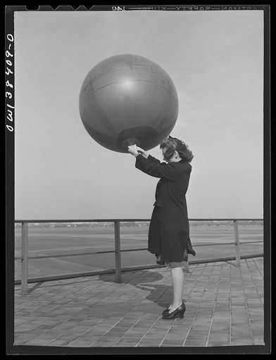 Washington, D.C. The U.S. Weather Bureau station at the National Airport. Pilot balloon being released to determine wind direction and velocity aloft