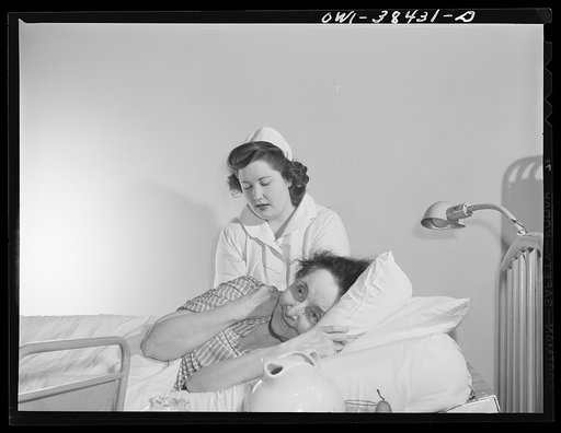 Washington, D.C. Eleanor Jefferis, a student at Woodrow Wilson High School who is a nurse's aide, giving an alcohol rub to a patient at emergency hospital
