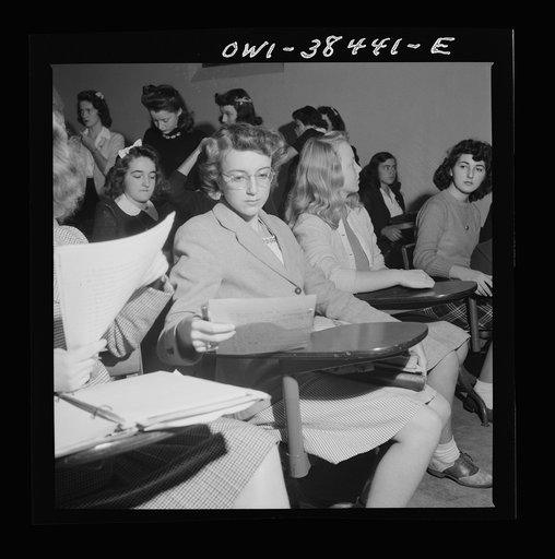 Washington, D.C. Handing in papers after a test in a health education class at Woodrow Wilson High School