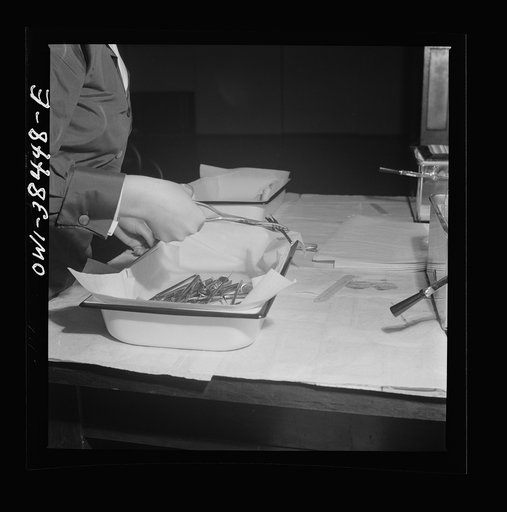 Washington, D.C. Hygienist preparing instruments used in the dental checkup which is given yearly to students of all Washington schools