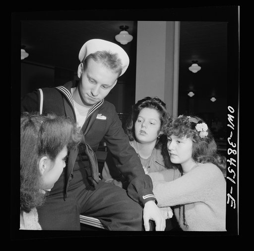 Washington, D.C. Graduate from Woodrow Wilson High School in June, this sailor is surrounded by girls when he returns from a visit