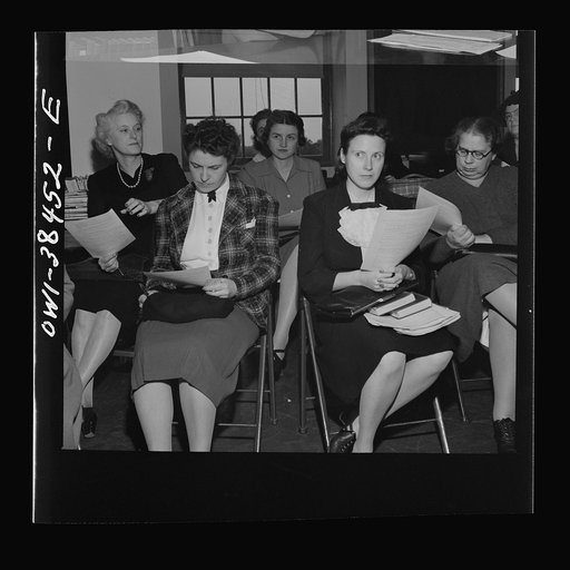 Washington, D.C. Teachers listening to instructions for giving out ration book no. 4 at Woodrow Wilson High School