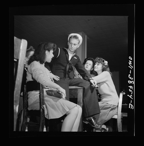 Untitled photo, possibly related to: Washington, D.C. Graduate from Woodrow Wilson High School in June, this sailor is surrounded by girls when he returns from a visit