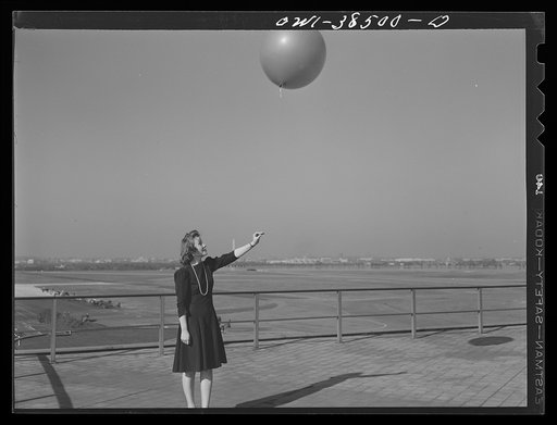 Washington, D.C. The U.S. Weather Bureau station at the National Airport. Pilot balloon being released to determine wind direction and velocity aloft