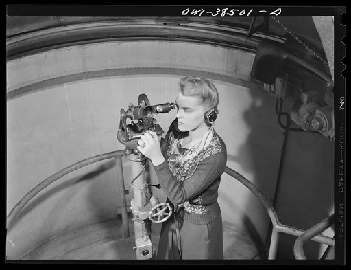 Washington, D.C. The U.S. Weather Bureau station at the National Airport. Following the course of a pilot balloon through the atmosphere with a theodolite instrument which measures the position