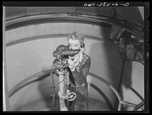Washington, D.C. The U.S. Weather Bureau station at the National Airport. Following the course of a pilot balloon through the atmosphere with a theodolite instrument which measures the position