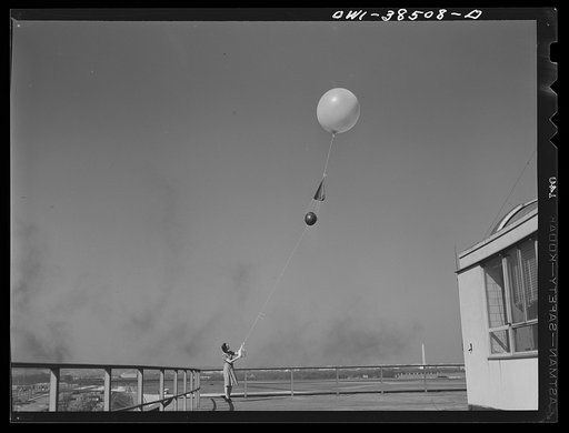 Washington, D.C. The U.S. Weather Bureau station at the National Airport. Atmospheric conditions are transmitted by a weather radio instrument attached to the balloon which ascends to heights of fifteen to twenty miles