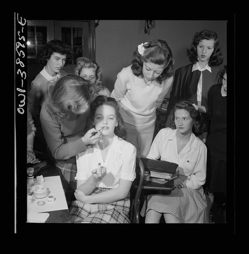 Washington, D.C. A demonstration of the correct procedure in applying street makeup in a home management class at Woodrow Wilson High School