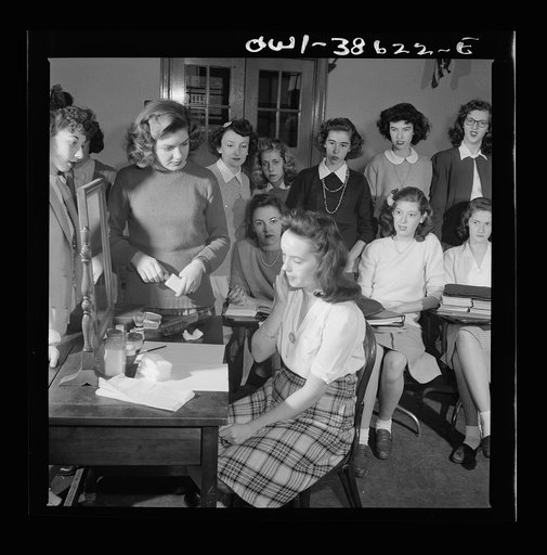 Washington, D.C. A demonstration of the correct procedure in applying street makeup in a home management class at Woodrow Wilson High School