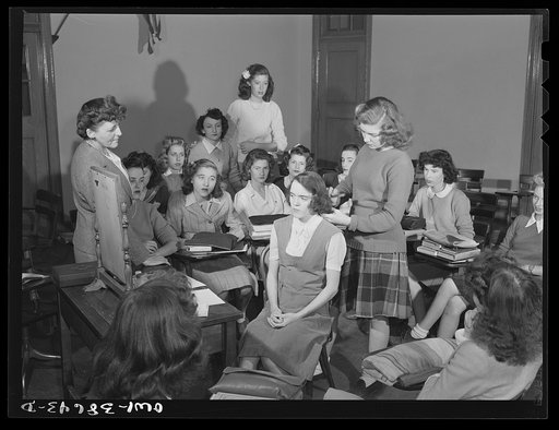 Washington, D.C. Mrs. Mary Spangler watching students of her home management class at Woodrow Wilson High School demonstrate how to apply street makeup