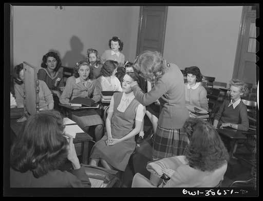 Washington, D.C. A demonstration of correct procedure in applying street makeup in a home management class at Woodrow Wilson High School