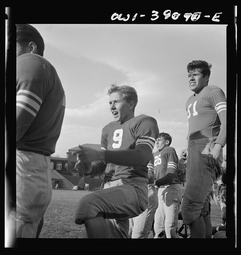 Washington, D.C. Members of the Woodrow Wilson High School football team watching a game from the sidelines