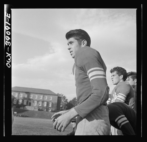 Washington, D.C. Members of the Woodrow Wilson High School football team watching a game from the sidelines