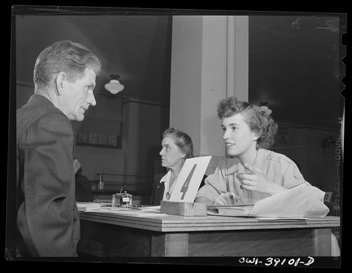 Washington, D.C. Sally Dessez, a student at Woodrow Wilson High School, questioning an applicant for a ration book