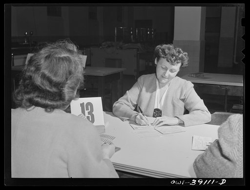 Washington, D.C. Mrs. Spangler, a Woodrow Wilson faculty member, filling out a ration book application