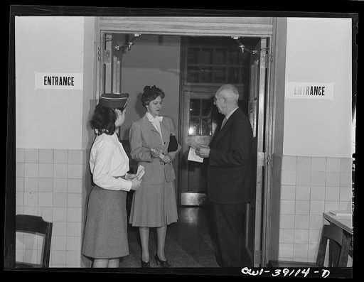 Washington, D.C. Faculty member and students assisting ration book applicants at Woodrow Wilson High School