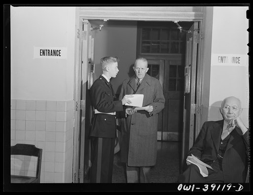 Washington, D.C. A student assisting a ration book applicant at Woodrow Wilson High School