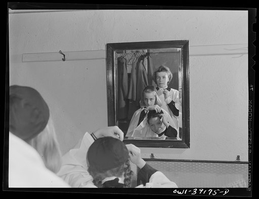 Washington, D.C. Sally Dessez, a student at Woodrow Wilson High School, getting her robe before singing with the choir at church