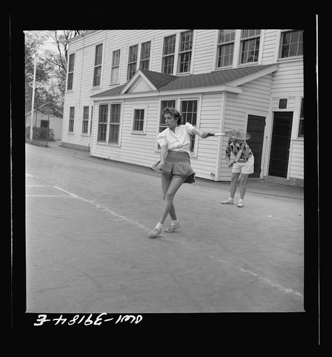 Washington, D.C. Sally Dessez, a student at Woodrow Wilson High School, playing a tennis match