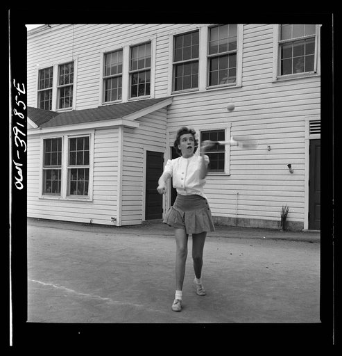 Washington, D.C. Sally Dessez, a student at Woodrow Wilson High School, playing a tennis match