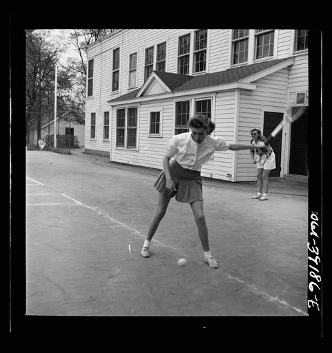 Washington, D.C. Sally Dessez, a student at Woodrow Wilson High School, playing a tennis match