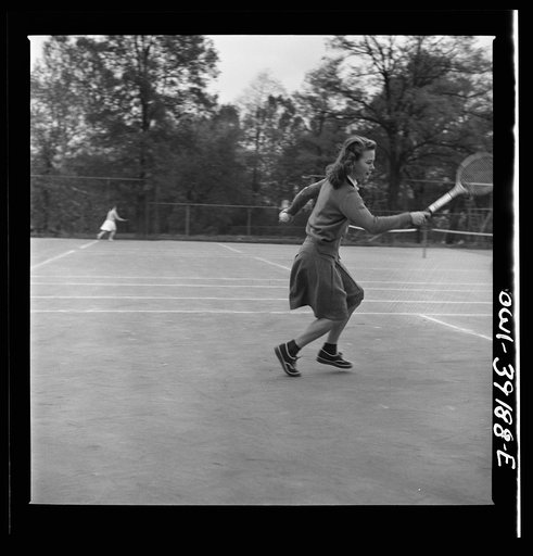 Untitled photo, possibly related to: Washington, D.C. A Woodrow Wilson High School student playing tennis at a court near the school