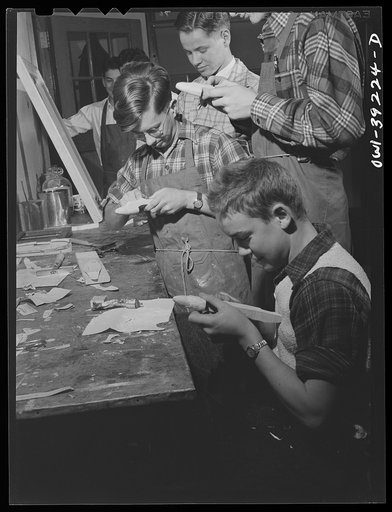 Washington, D.C. Members of a wood-making class at Woodrow Wilson High School making model planes for use by the U.S. Navy