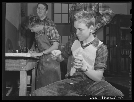 Washington, D.C. Members of a wood-making class at Woodrow Wilson High School making model planes for use by the U.S. Navy