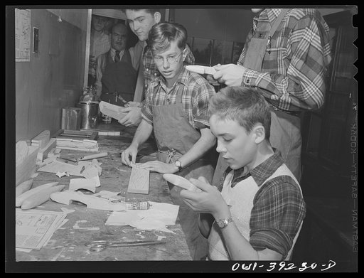 Washington, D.C. Members of a wood-making class at Woodrow Wilson High School making model planes for use by the U.S. Navy