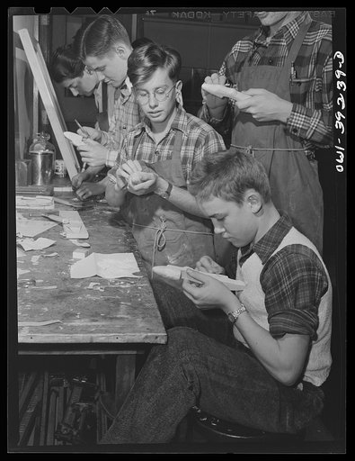 Washington, D.C. Members of a wood-making class at Woodrow Wilson High School making model planes for use by the U.S. Navy