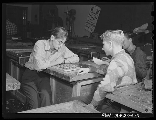Washington, D.C. Wood shop students at Woodrow Wilson High School playing checkers on a board which they built