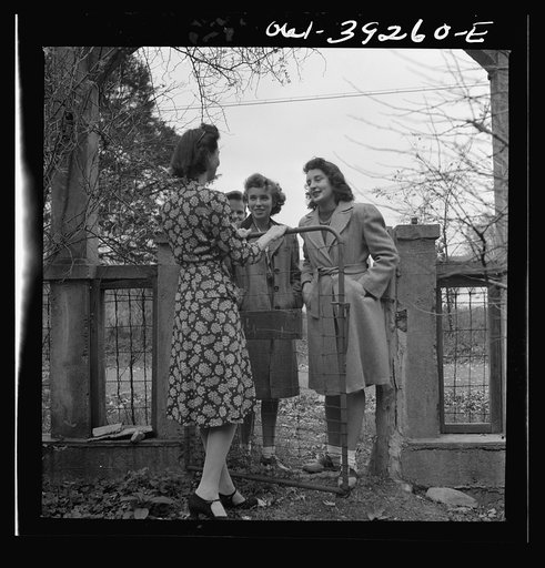 Washington, D.C. Miss Norma Kale, an English teacher at Woodrow Wilson High School, greeting some of her students who have come to her home on a Sunday afternoon