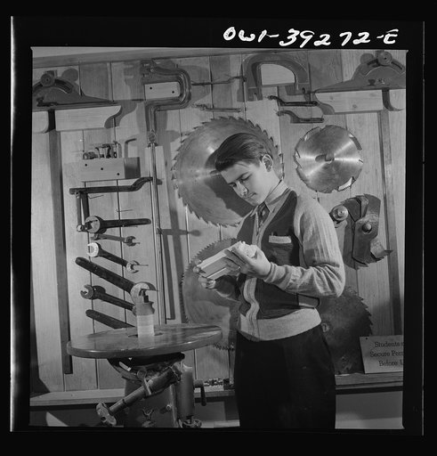 Washington, D.C. Using the sanding machine in the wood shop at Woodrow Wilson High School