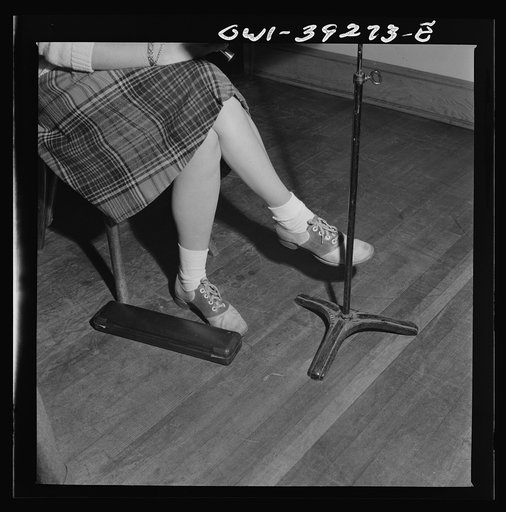 Washington, D.C. The feet of a flute player in the Woodrow Wilson High School orchestra