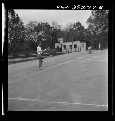 Untitled photo, possibly related to: Washington, D.C. Sally Dessez, a student at Woodrow Wilson High School, playing a tennis match