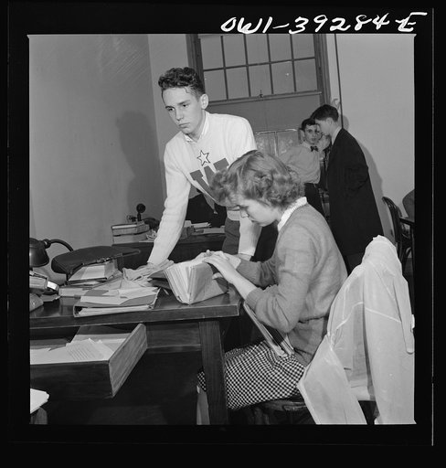 Washington, D.C. Sally Dessez, editor of the Woodrow Wilson High School yearbook, talking with Walter Spangenberg in the publications office