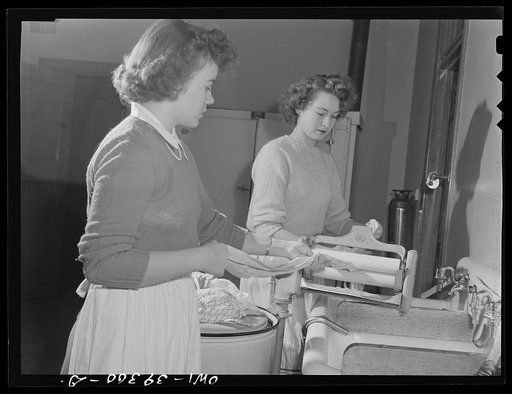 Washington, D.C. Home economics students working in the model laundry at the Woodrow Wilson High School