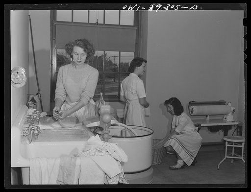 Washington, D.C. Home economics students working in the model laundry at the Woodrow Wilson High School