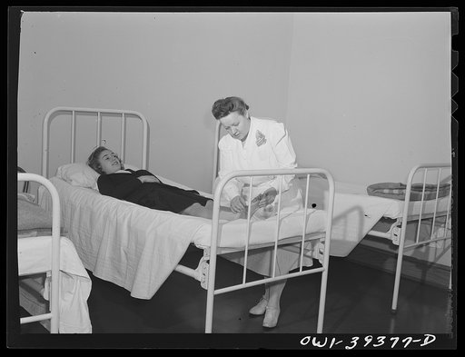 Washington, D.C. The Woodrow Wilson High School nurse examining the foot of a student who was hurt in a gymnasium class