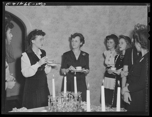 Washington, D.C. Members of a Woodrow Wilson High School sorority serving tea for their mothers at the home of their advisor, Mrs. Mary Spangler (center)
