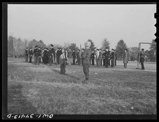 Washington, D.C. Small boys watching the Woodrow Wilson High School cadets