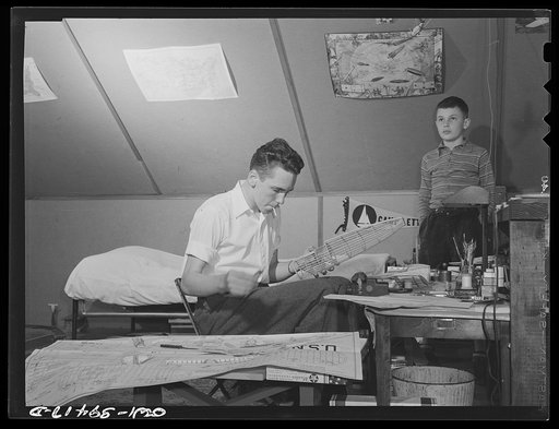 Washington, D.C. Walter Spangenberg, a student at Woodrow Wilson High School, has fitted up a workshop in the attic of his home where he builds model airplanes, ships and trains