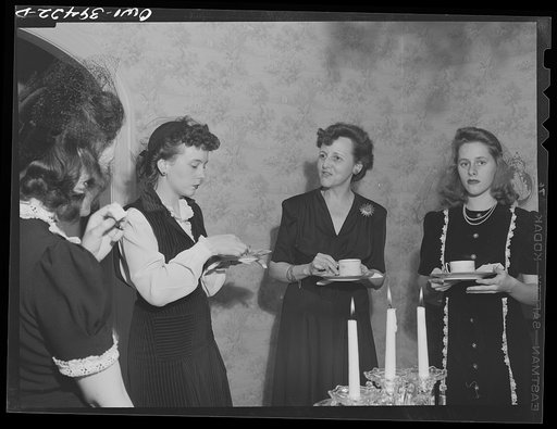 Washington, D.C. Members of a Woodrow Wilson High School sorority serving tea for their mothers at the home of their advisor, Mrs. Mary Spangler (right)