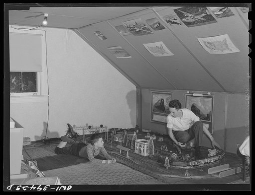 Washington, D.C. Walter Spangenberg, a student at Woodrow Wilson High School and his nine year old brother working on the railroad in the attic workshop which Walter has fitted up