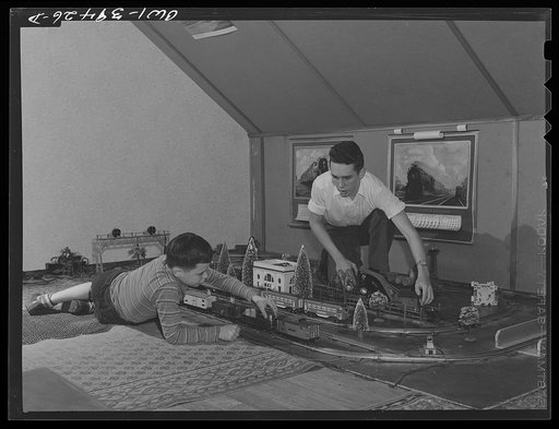 Washington, D.C. Walter Spangenberg, a student at Woodrow Wilson High School and his nine year-old brother on the model railroad in the attic workshop which Walter has fitted up