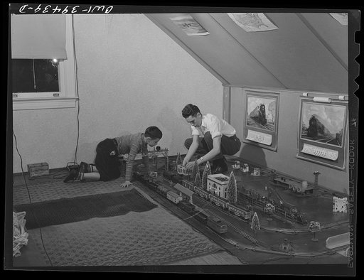 Washington, D.C. Walter Spangenberg, a student at Woodrow Wilson High School, and his nine year-old brother working in the model railroad in the attic workshop which Walter has fitted up
