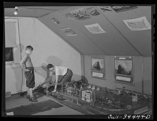 Washington, D.C. Walter Spangenberg, a student at Woodrow Wilson High School, and his nine year-old brother working on the model railroad in the attic workshop which Walter has fitted up