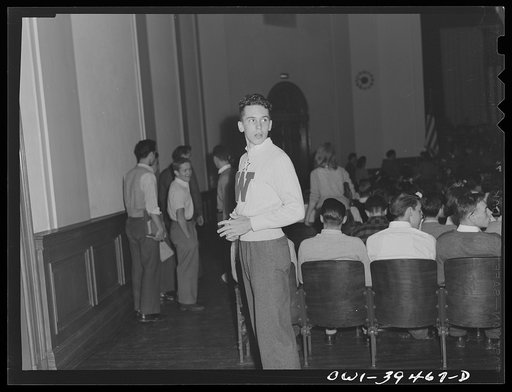 Washington, D.C. Walter Spangenberg acting as usher at a student assembly at Woodrow Wilson High School